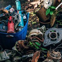 Old car parts at a rubbish tip